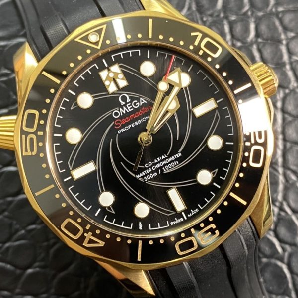 Golden Omega model watch, paired with black silicon strap